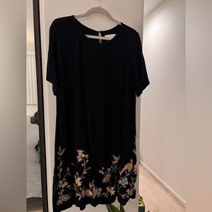 Navy blue embroidered knee length short sleeved dress.